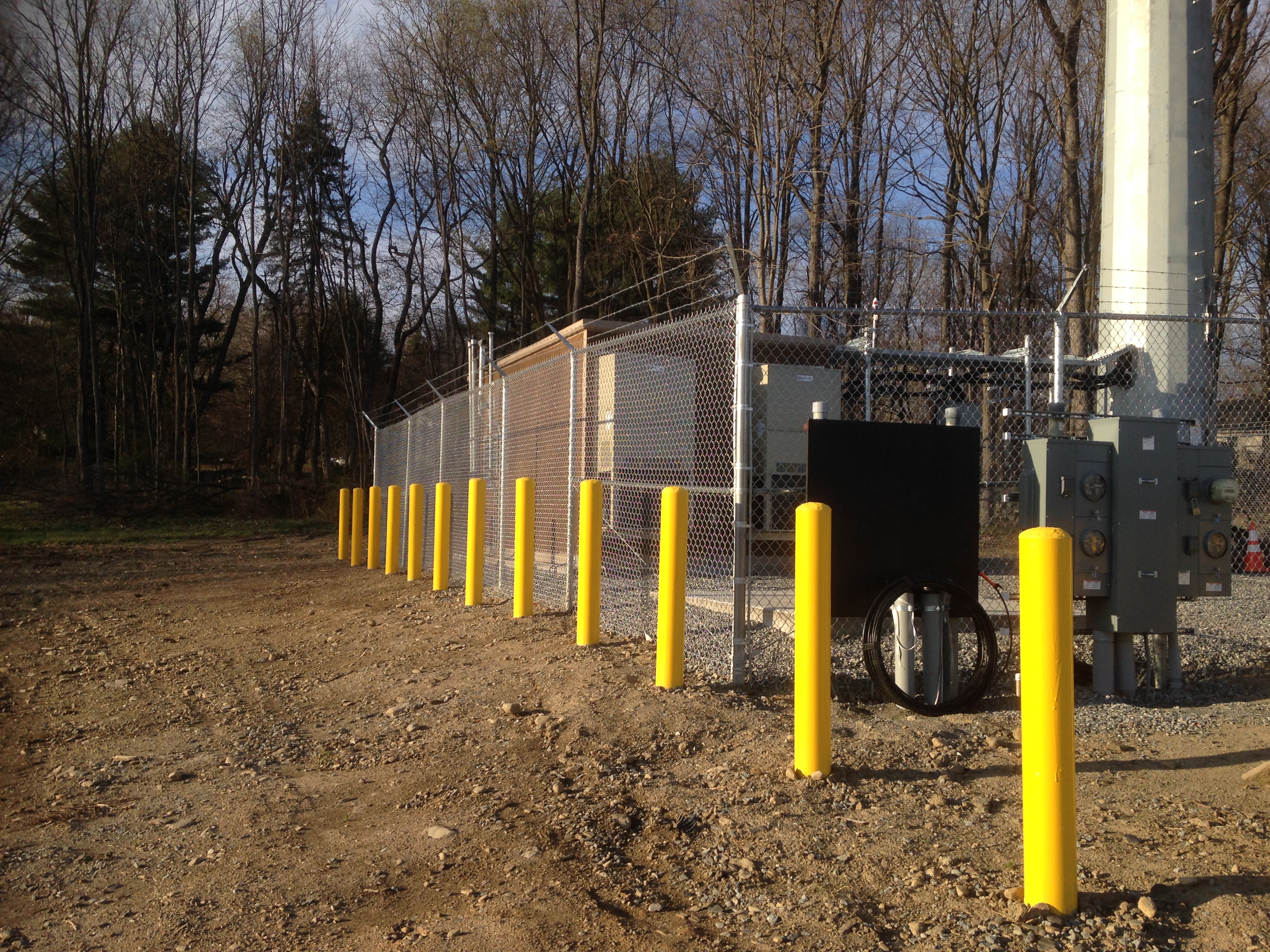 8 Chainlink fence with barbed wire around a cell tower