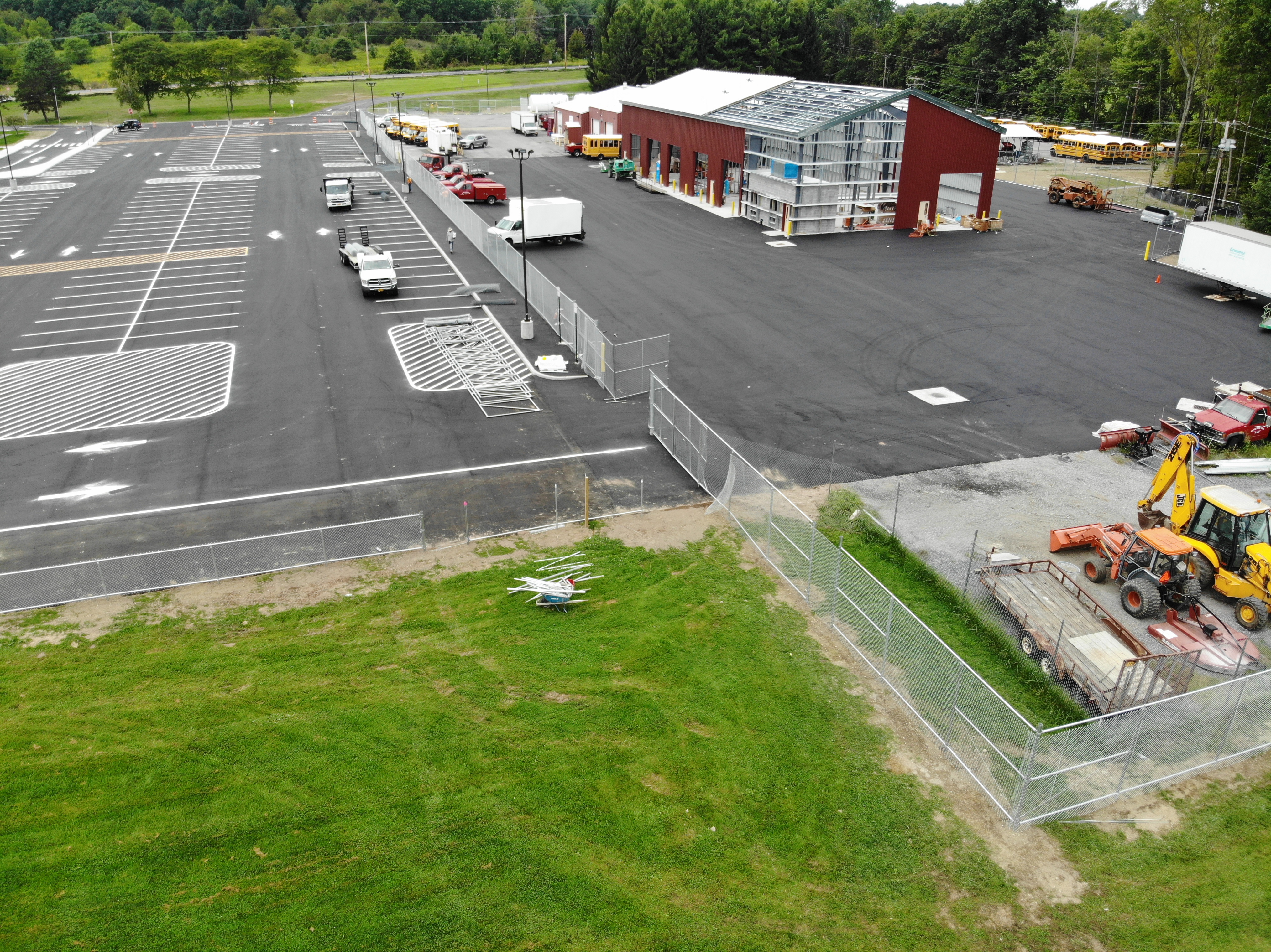photograph of steel chainlink fence around school bus garage