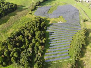 Aerial shot of the entire solar farm, depicting the scale and size of the perimeter fence.