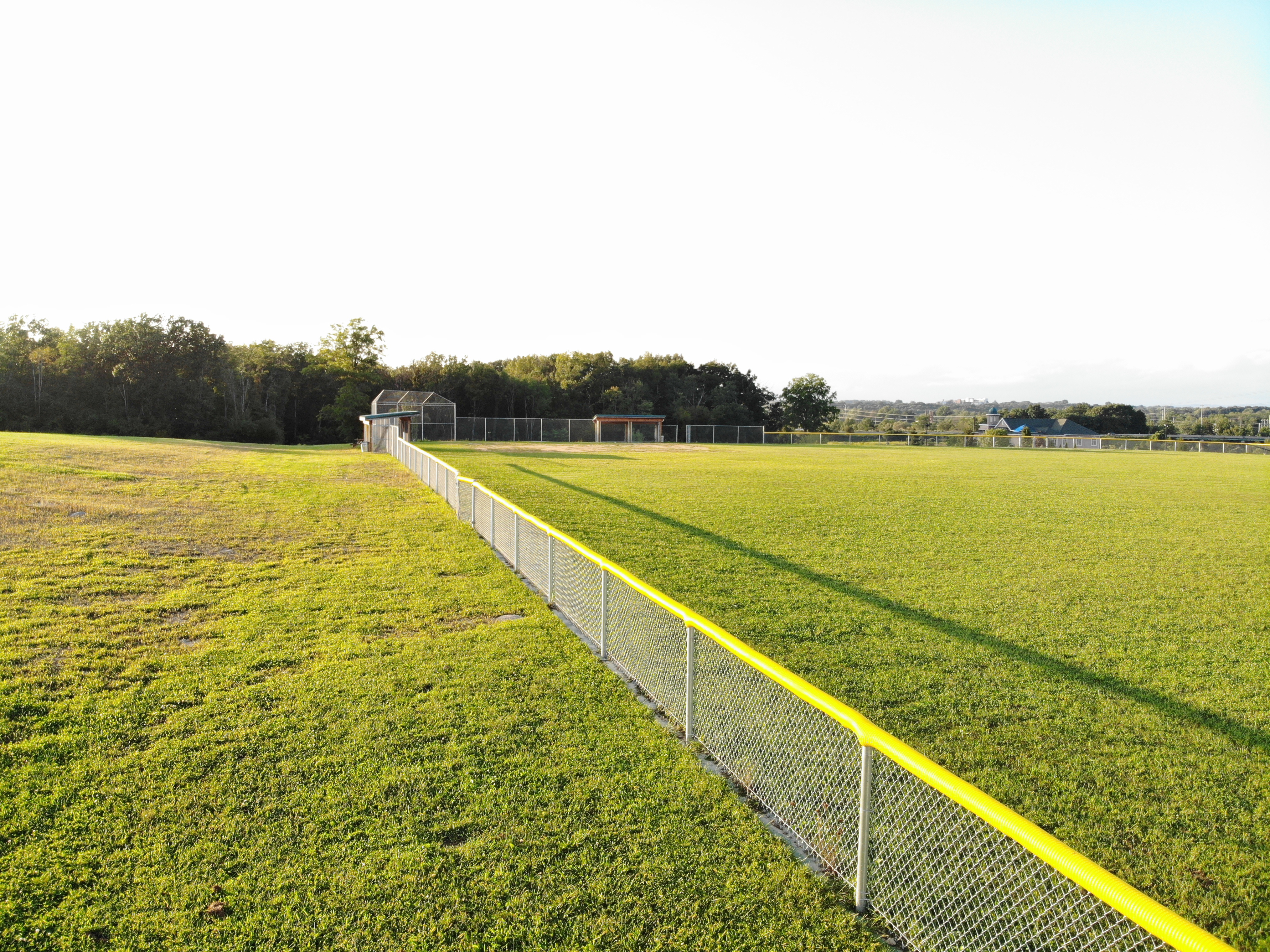 Here you see the sideline fence of the baseball field, looking from the outfield towards the backstop.