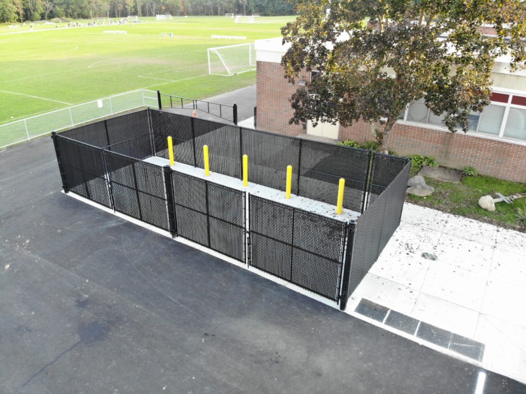 Aerial View of black dumpster enclosure