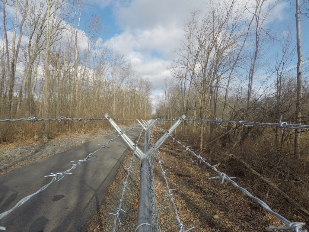 Barbed wire installed on chainlink fence
