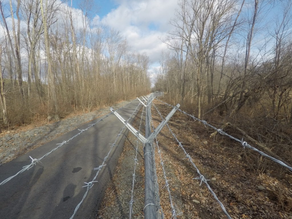 Barbed wire installed on chainlink fence